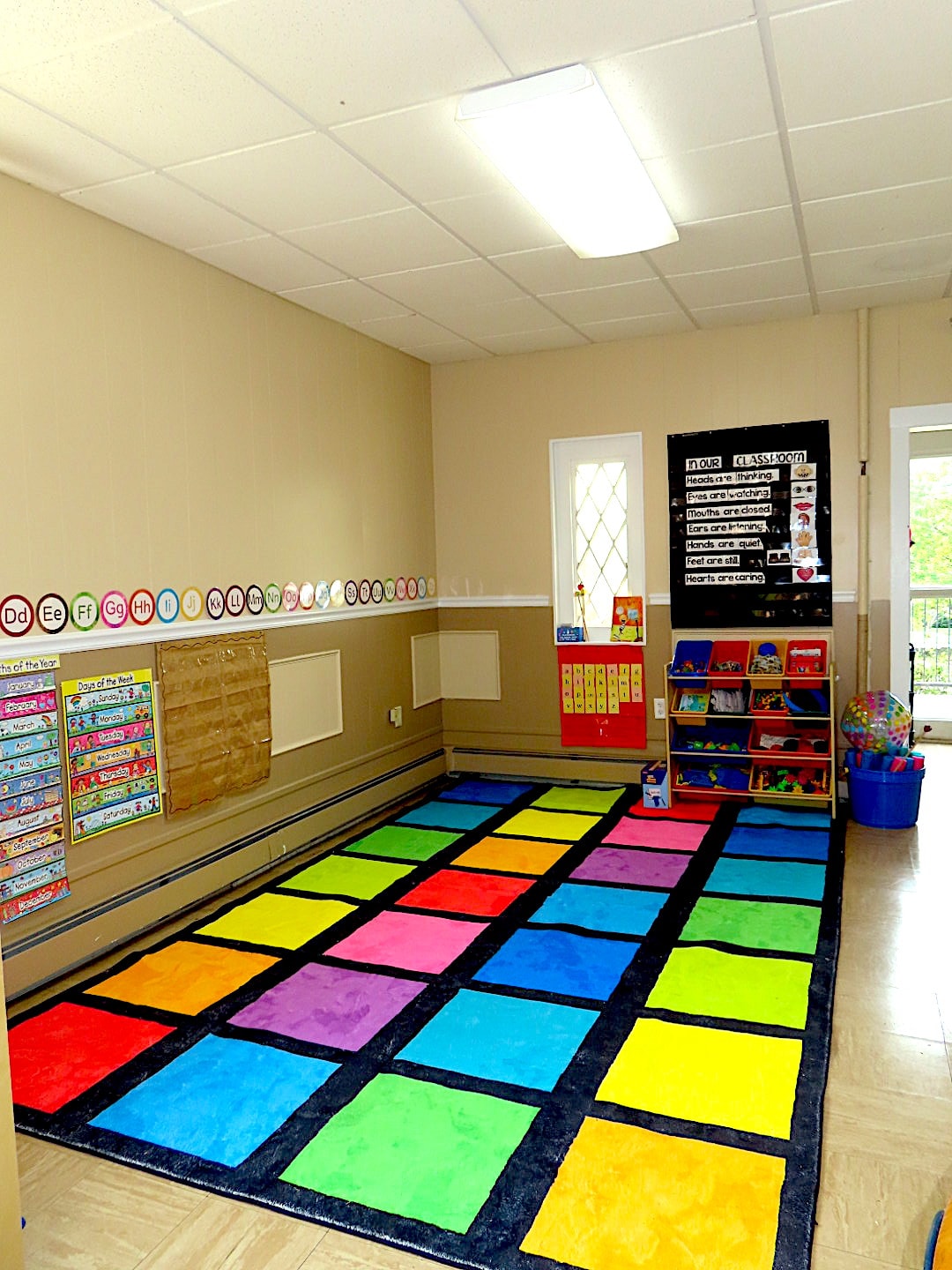Colorful classroom with alphabet rug