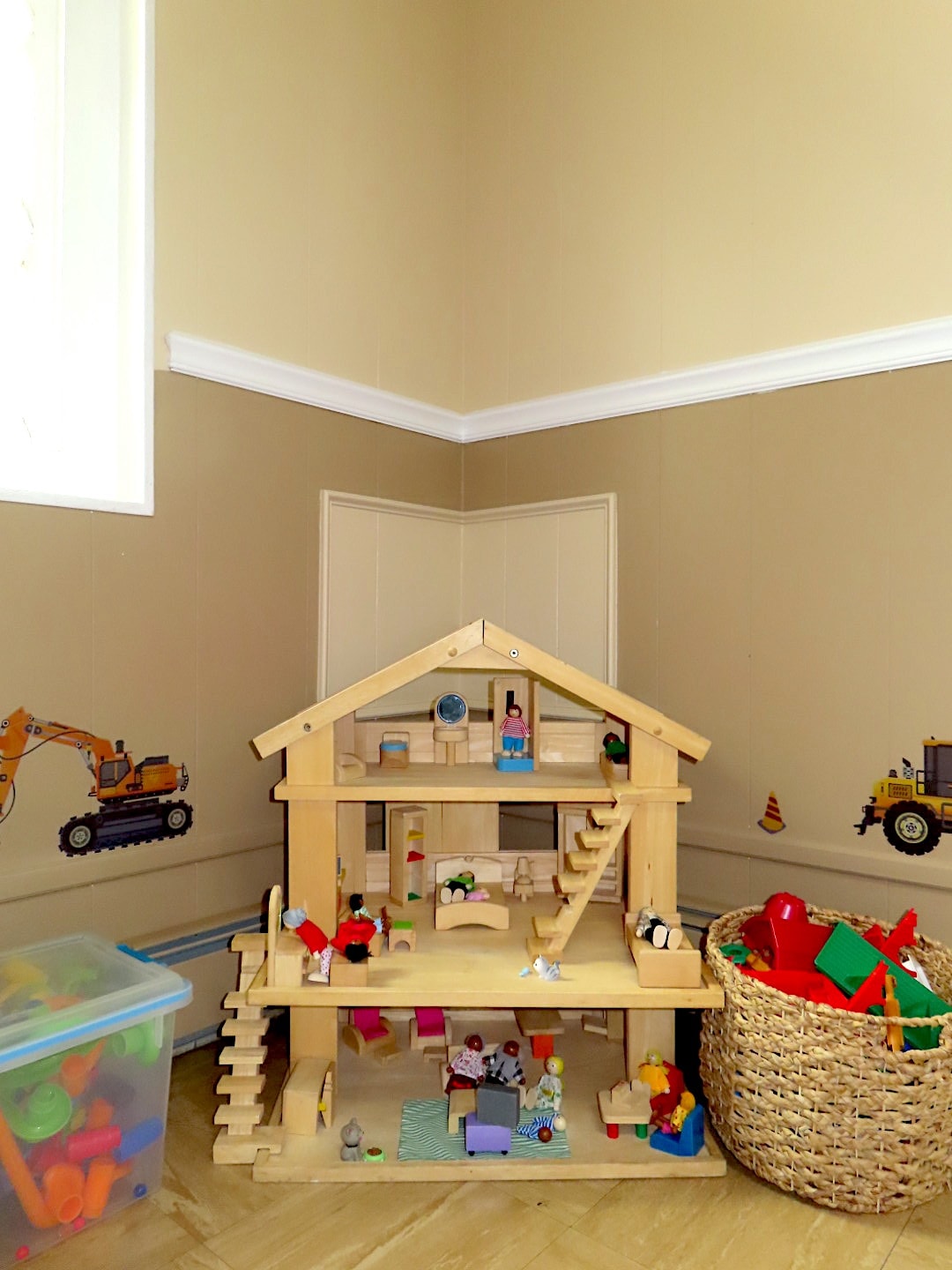 Wooden dollhouse with miniature furniture