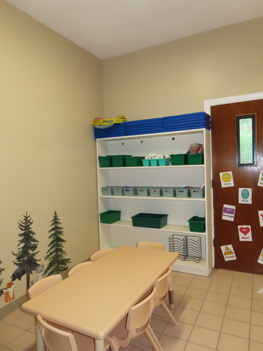 Classroom storage shelves with activity table